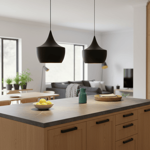 Two Miso Nordic Pendant Lights hang over a kitchen island with a bowl of lemons and a green pitcher.