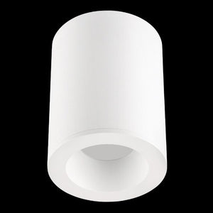 White cylindrical surface‑mount downlight holder with recessed GU10 socket against a plain black background