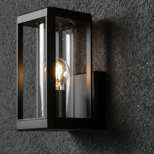 Close-up of the Bhok Ali Square Outdoor Wall Light showcasing its black die-cast aluminum frame and clear glass.