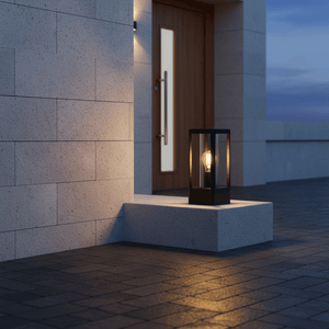 Bhok Ali Square Outdoor Post Top Light on a stone platform near a wooden door, providing warm illumination.