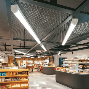 Linkable batten lights installed in a modern bakery, illuminating the space with bright, adjustable white light.