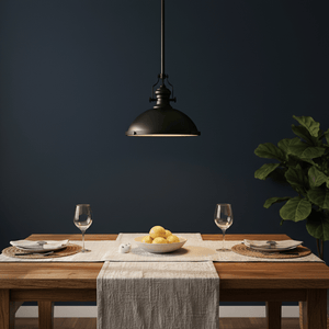 Black Nautical Pendant light hanging above a dining table set with plates and a bowl of lemons.