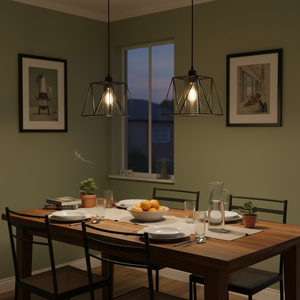 Stylish metal pendant lights with smoked glass shades hang over a wooden dining table set for a meal.
