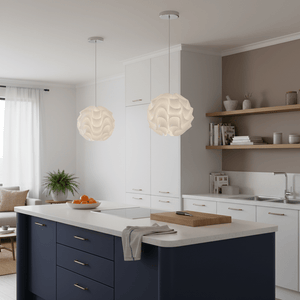 Two white wavy pendant lights hanging over a kitchen island, providing soft ambient light.