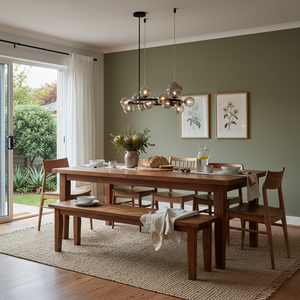 Stylish dining area featuring a wooden table and the Nebula Metal Pendant with smoke glass above, enhancing the modern decor.