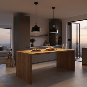 Two black metal and wood pendant lights hang over a wooden dining table with bread and fruit.