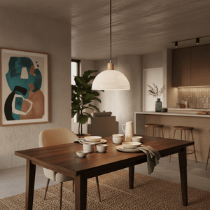Stylish pendant light with alabaster glass and wood finish above a dining table set with dishes.