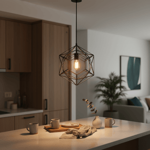 Black metal pendant light hanging over a kitchen island with mugs and a plate on the counter.