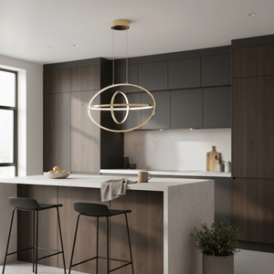 Sleek French Gold aluminium pendant light hanging above a modern kitchen island with bar stools.