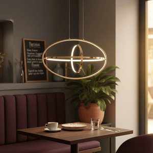 Sleek French Gold LED pendant light hanging above a dining table with a coffee cup and plate.