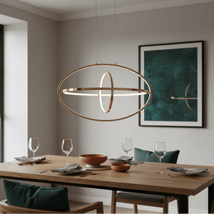 Sleek French Gold LED pendant light hanging above a modern dining table set with glasses and plates.