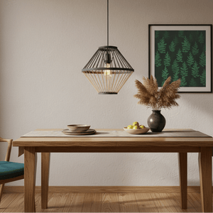 Dining room with wooden table, pendant light, and framed artwork on a beige wall.