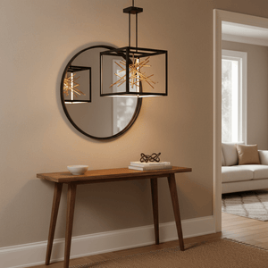 Black and gold LED pendant light hanging above a wooden console table with a round mirror.