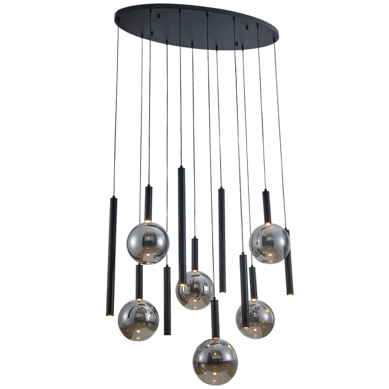 Modern pendant light with black cylindrical and spherical glass lampshades on a white background