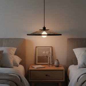 Hara Bamboo & Metal Pendant Light hanging above a bedside table with soft lighting.