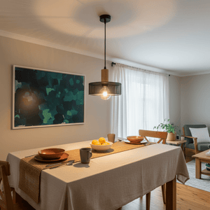 Enid Pendant Light hanging above a dining table set with plates and a bowl of lemons, in a cozy interior.