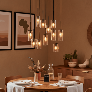 Stylish dining setup featuring the Akroyd 11 Light Amber Glass Pendant above a wooden table with decorative elements.