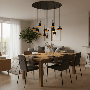 Stylish dining area featuring the Skyfall 11 Light pendant above a wooden table set for dinner.
