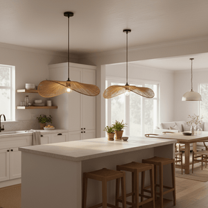 Two Aporia Natural Rattan Pendants hang above a kitchen island, complementing a bright, airy space.