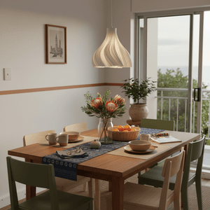 Pendant light with a white and yellow glass shade on a green background