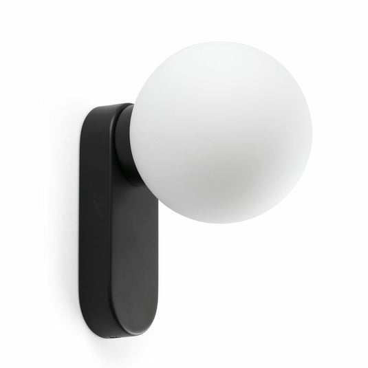 Wall-mounted light fixture with black arm and white globe on a white background
