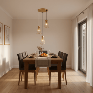 Stylish dining setup featuring the Sensu Cluster Gold Pendant Light above a wooden table with elegant tableware.