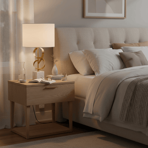 Elegant marble and gold table lamp on a bedside table, complementing a cozy bedroom setting.