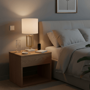 Chopin Gold & Marble Table Lamp on a bedside table, illuminating a cozy bedroom setting.