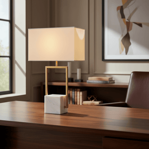 Verdi Gold & Marble Table Lamp on a wooden desk, featuring a marble base and fabric shade, with a stylish office background.