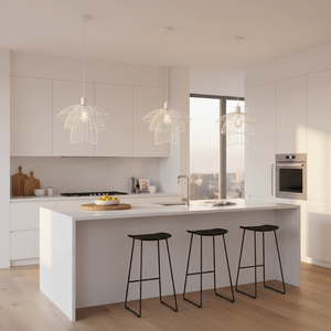 Three white pendant lights hang above a modern kitchen island with black stools, creating a stylish focal point.