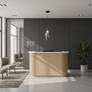 A sleek black smoke pendant light hangs above a modern wooden reception desk in a minimalist office space.