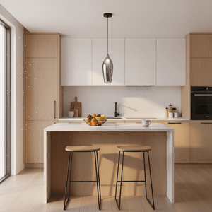 A modern kitchen featuring a Nelo Black Smoke Pendant Light above a white countertop, with wooden cabinets and two stools.