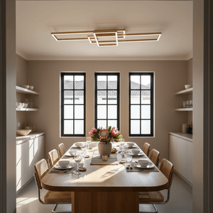 Modern flush LED ceiling light illuminating a dining table set for a meal in a stylish kitchen.