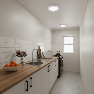 Modern kitchen featuring the IrisUltra-Slim LED Ceiling Light, highlighting a clean design with a wooden countertop and