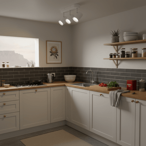 Modern white 3-light adjustable spotlight installed in a stylish kitchen, illuminating countertops and decor.