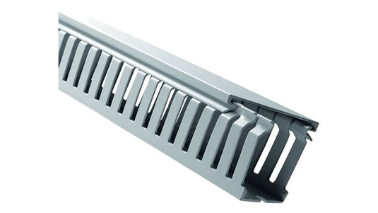 Grey slotted trunking for cable management, featuring narrow slots for neat routing and access.