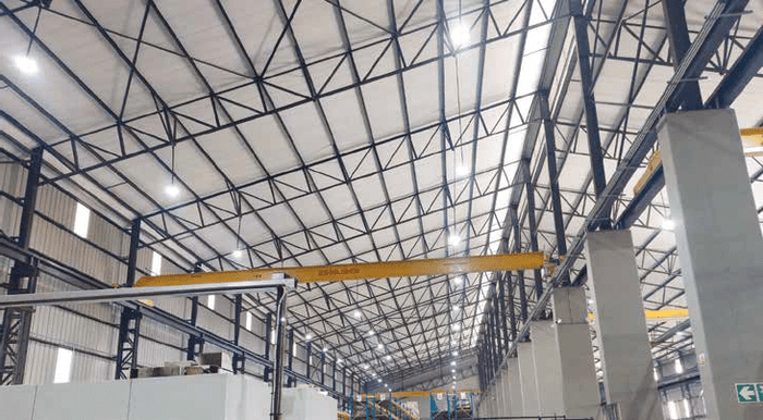 are UFO high bays the future of South African warehouses? local climate and industrial dust impact on LED fittings, durable warehouse lighting in a South African commercial setting with storm grey and copper accents