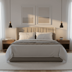 Stylish bedroom featuring a black marble and gold pendant light above a bed with neutral bedding.