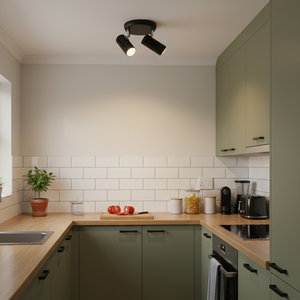 Modern matt black ceiling spotlight with two adjustable heads installed in a stylish kitchen.
