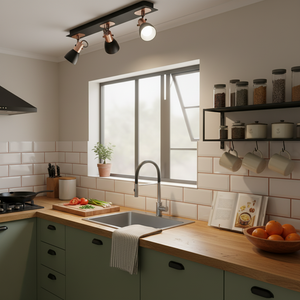 Modern black and copper spotlight installed in a stylish kitchen, illuminating the sink and countertop.