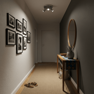Hallway with a satin chrome 3-head spotlight illuminating framed photos and a console table.