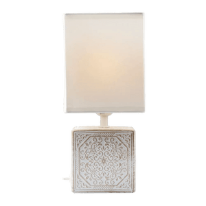 A white table lamp with a square fabric shade and a decorative square base featuring intricate patterns.