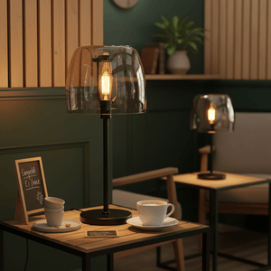 Campbell Cognac Table Lamp on a wooden side table with a cup and snacks, creating a cozy ambiance.