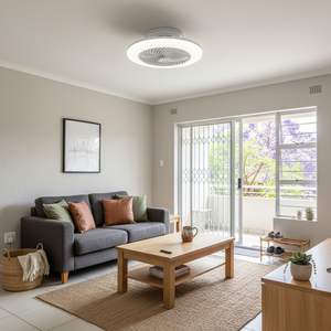 Modern living room featuring a stylish LED ceiling fan with integrated light above a cozy sofa and coffee table.