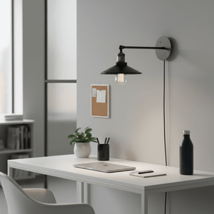Retro industrial wall reading light with long arm mounted above a modern desk, illuminating workspace.