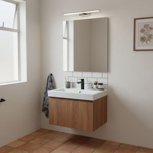 A polished aluminium LED mirror light mounted above a modern bathroom vanity with a mirror and sink.