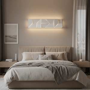 Mosaic rectangle LED wall light mounted above a bed, illuminating a stylish bedroom with neutral tones.