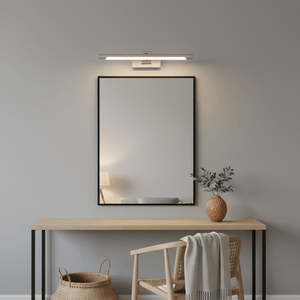 Stainless steel LED wall light mounted above a mirror on a modern wooden table, enhancing the space's ambiance.