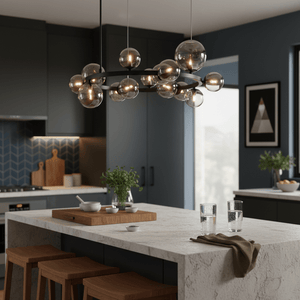Smoke glass pendant light hanging over a kitchen island with wooden stools and a marble countertop.