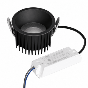 Black recessed LED downlight with a PMMA diffuser and remote driver, showcasing a sleek design.